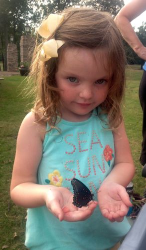 john jordan with granddaughter holding butterfly